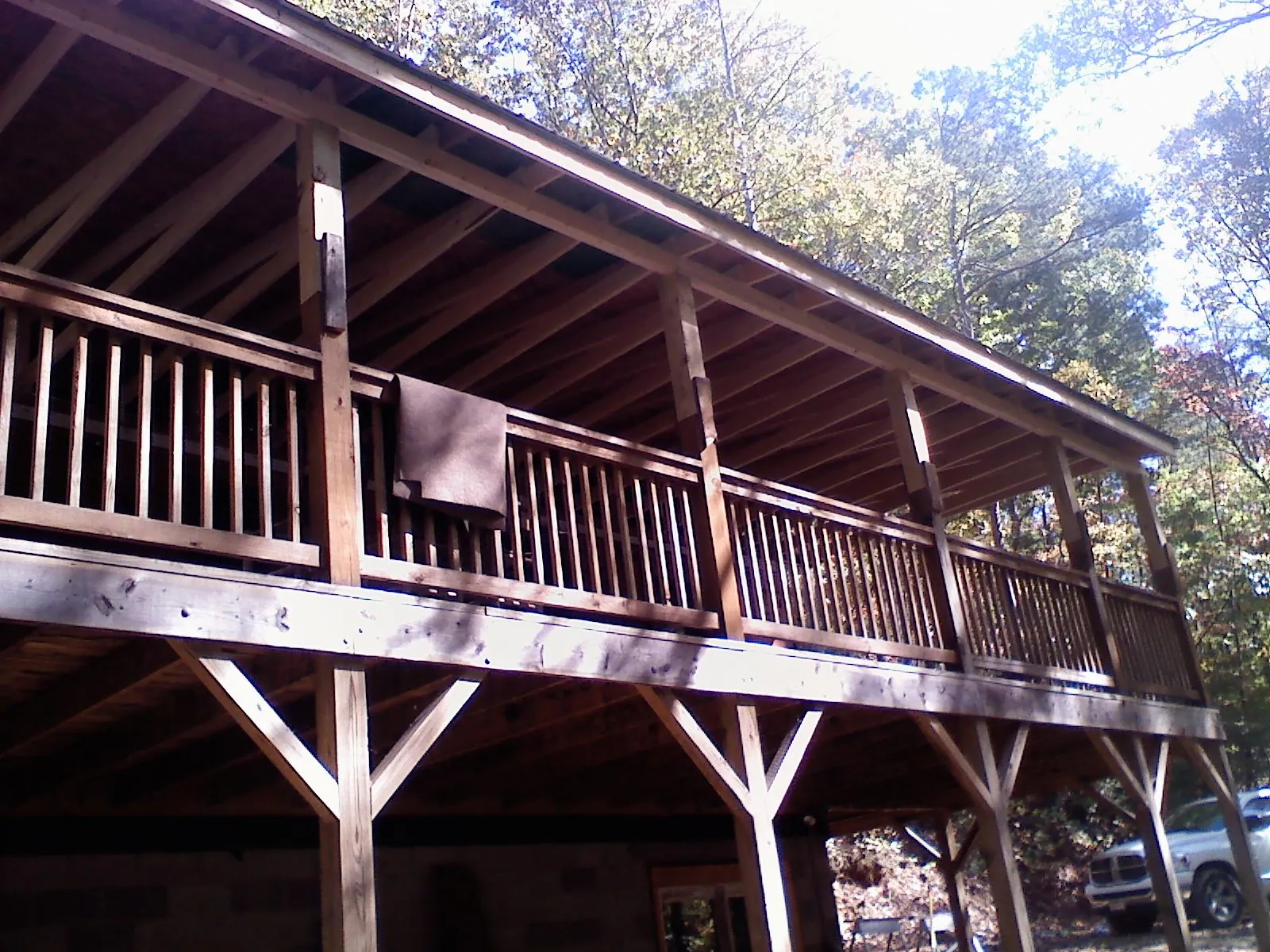 Timber framing under a new elevated porch and deck — Roof Leak Repair in Export by Roofing Brothers